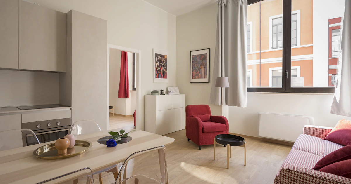 Bright contemporary living room with large windows and sofa